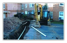 Water main trench dug by Sasso Plumbing & Heating